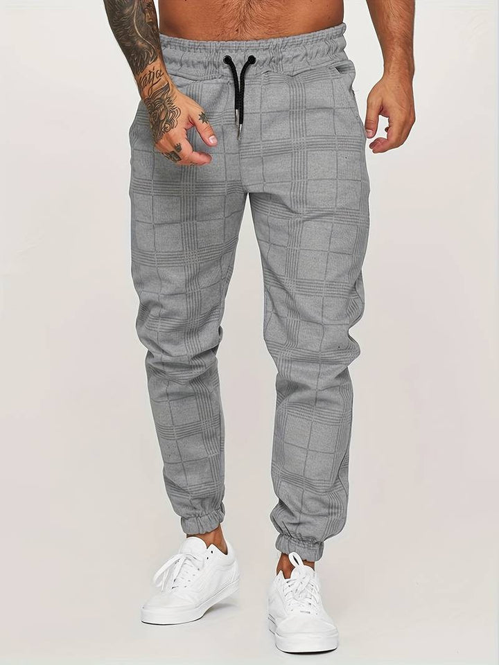 Levoire | Pantalon de course à slim fit à pois pour hommes Gris