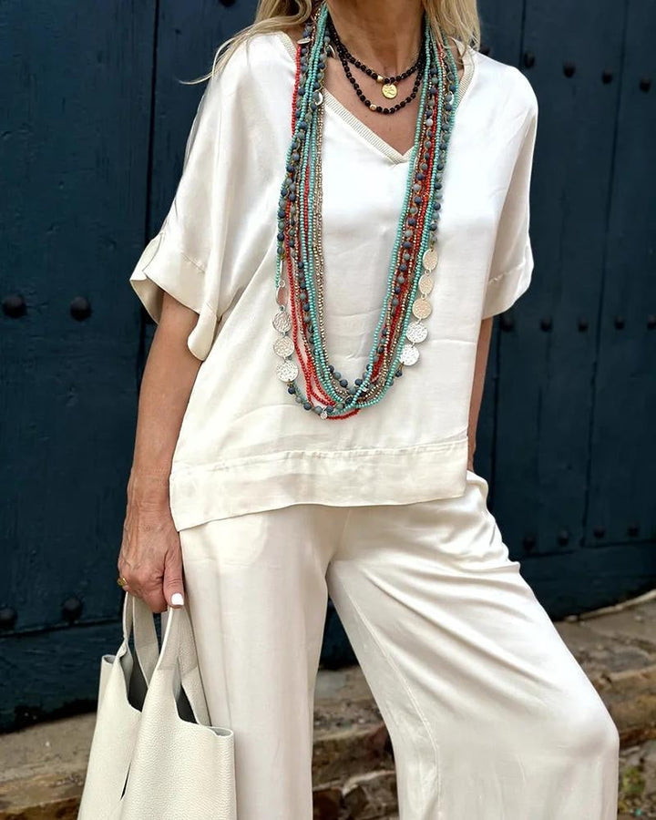 Levoire | Ensemble Élégant Composé D'Une Chemise À Col En V Blanc Et De Pantalons Évasés