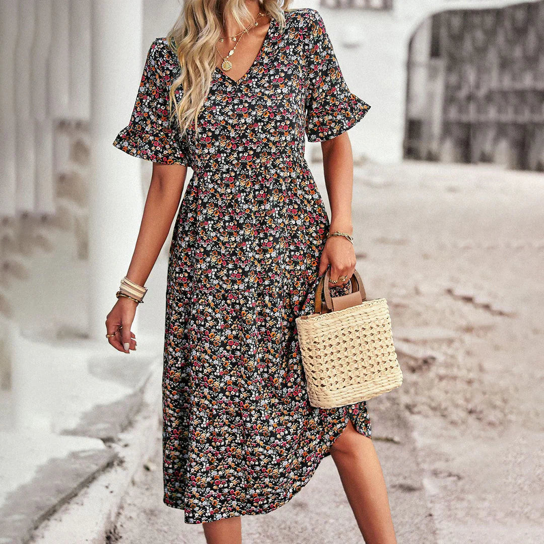Levoire | Robe D'Été Ludique En Abricot Avec Imprimé Floral Noir