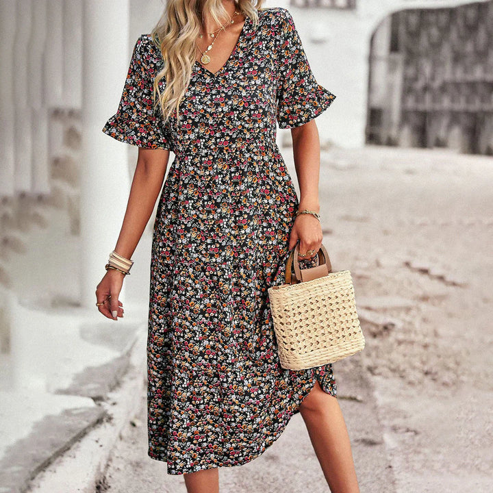 Levoire | Robe D'Été Ludique En Abricot Avec Imprimé Floral Noir