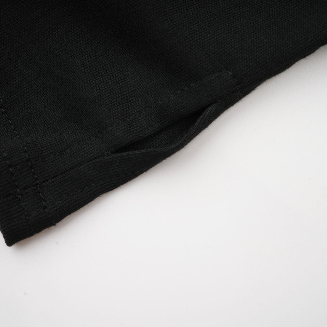 Levoire | Chemisier Noir À Volants En Jersey Extensible