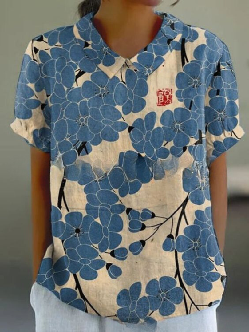Levoire | Blouse Féminine Élégante Avec Motif Floral Blanc avec des fleurs bleues