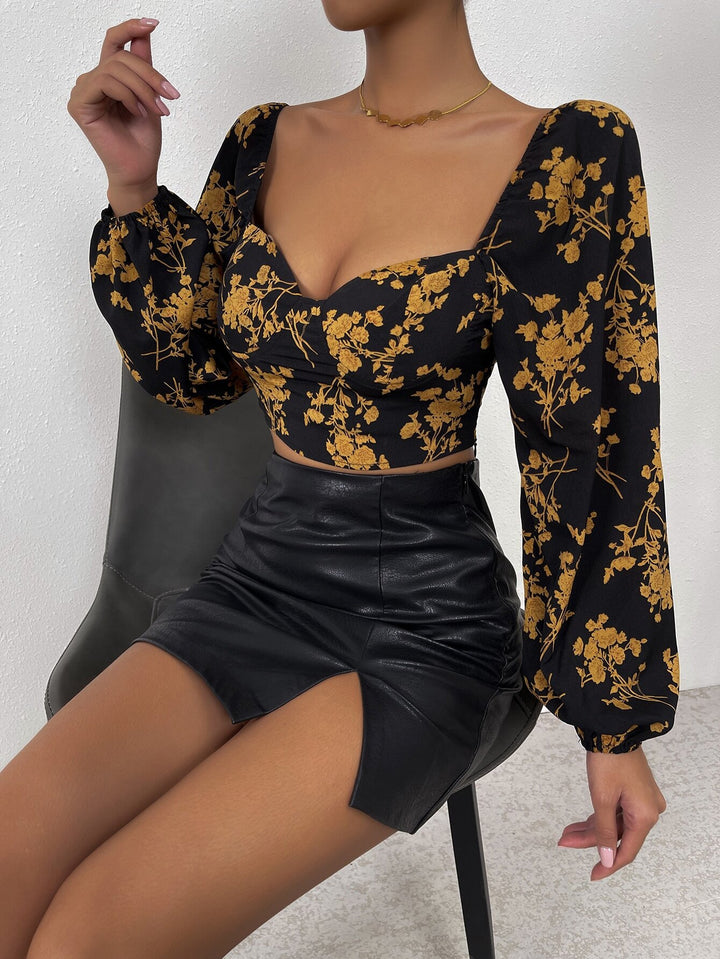 Top court féminin avec motif floral et élégante manches bouffantes Levoire