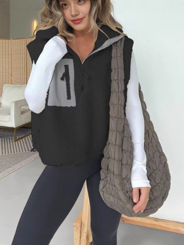 Gilet en polaire matelassé pour femmes avec fermeture éclair pratique et poches en fausse fourrure Levoire