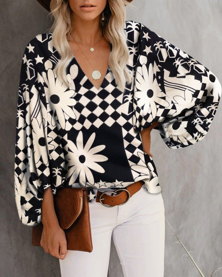 Blouse féminine à la mode avec des manches larges et un col en V Levoire