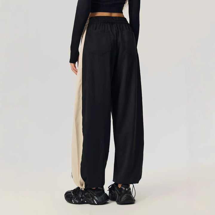 Pantalons de loisirs sportifs pour femmes avec coupe tendance et panneaux contrastés sur les côtés Levoire