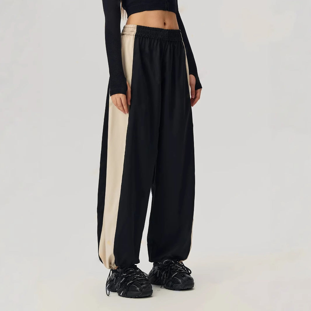 Pantalons de loisirs sportifs pour femmes avec coupe tendance et panneaux contrastés sur les côtés Levoire
