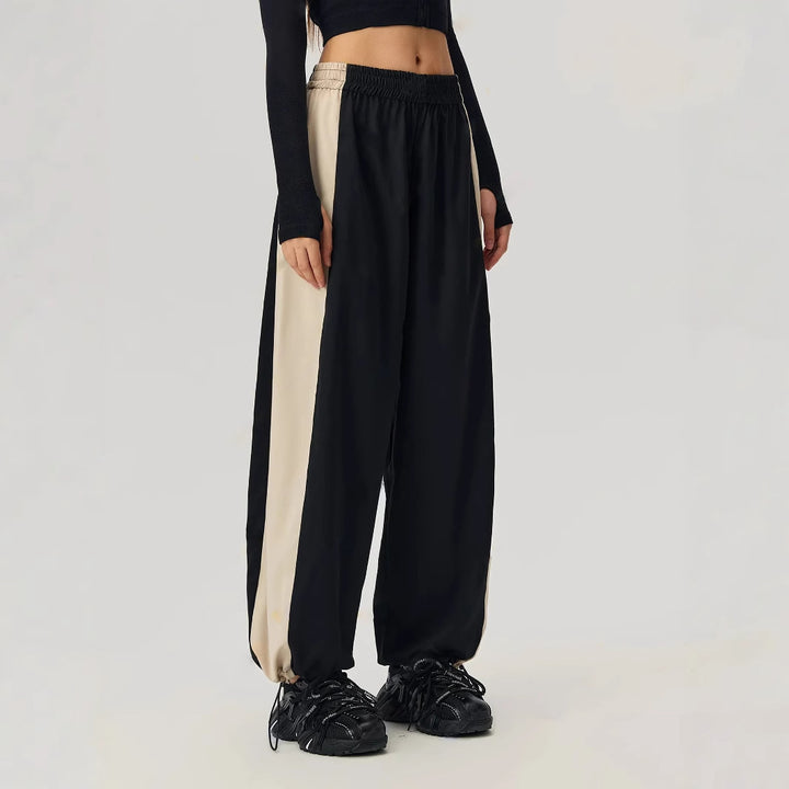 Pantalons de loisirs sportifs pour femmes avec coupe tendance et panneaux contrastés sur les côtés Levoire