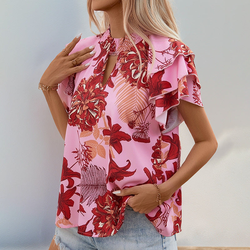 Top féminin avec des détails de volants ludiques et un motif floral Levoire