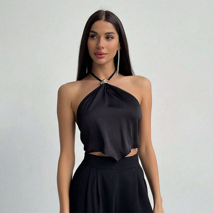 Haut halter élégant pour femmes avec tissu brillant et nœud décoratif Levoire