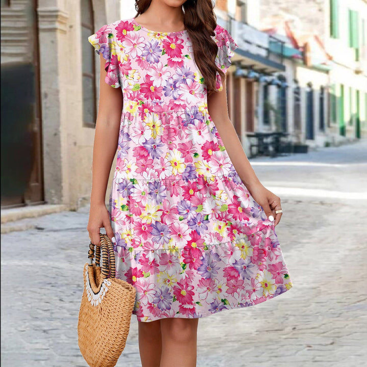 Levoire | Robe imprimée festive avec des manches en aile Rosa