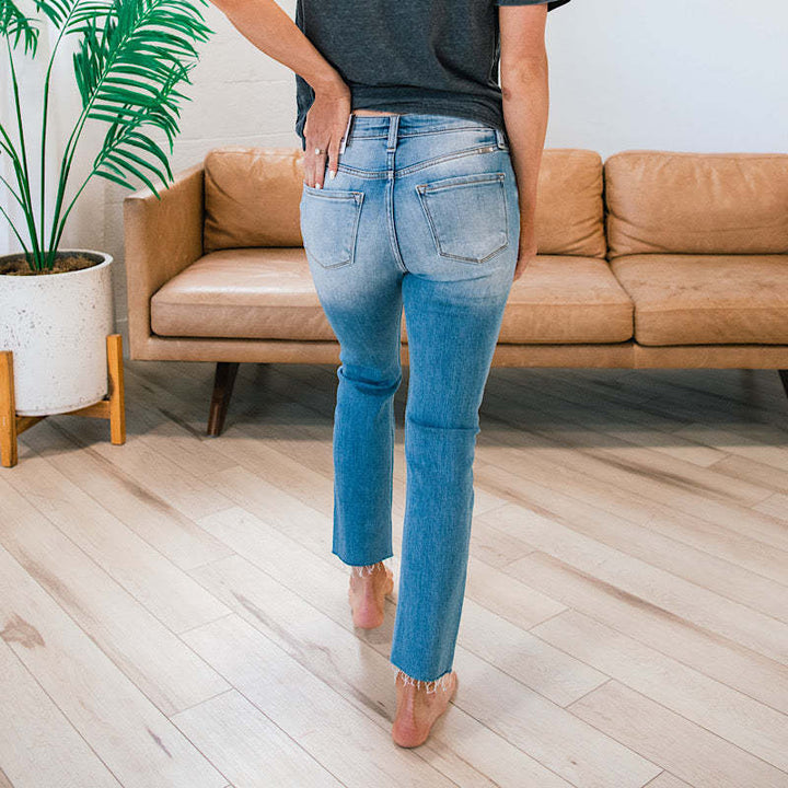 Jean femme taille haute avec insert à boutons et ourlet effiloché Levoire