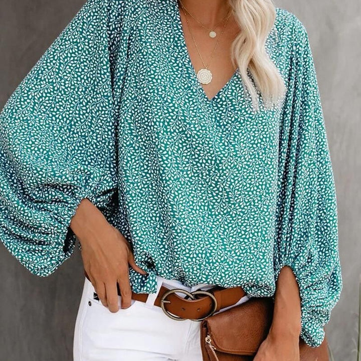 Blouse féminine à la mode avec des manches larges et un col en V Levoire