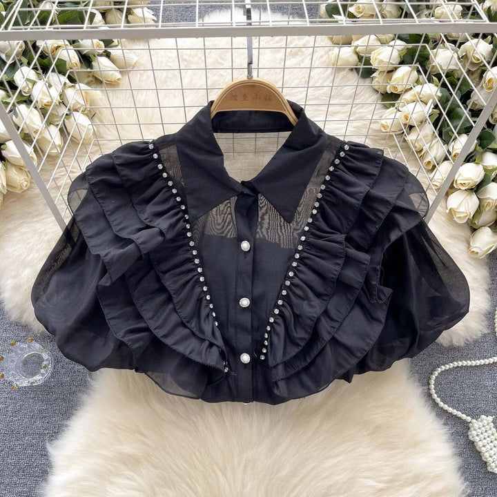 Levoire | Top avec des diamants transparents et fins et des manches bouffantes Noir Taille libre