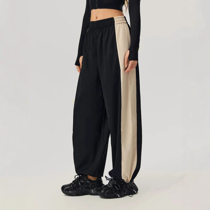 Pantalons de loisirs sportifs pour femmes avec coupe tendance et panneaux contrastés sur les côtés Levoire