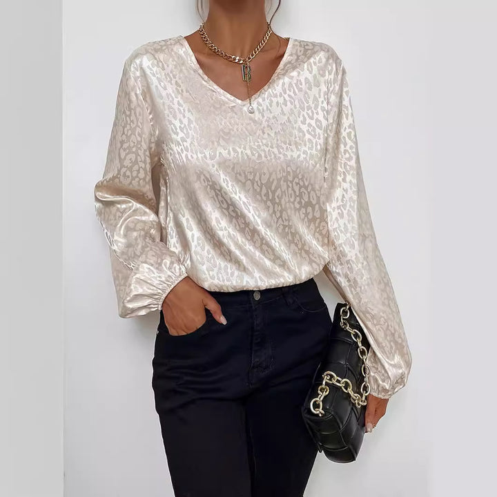 Blouse élégante pour femmes avec un col en V moderne et un motif orné Levoire