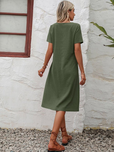 Levoire | Robe en coton à col montant à manches courtes avec plumes unies