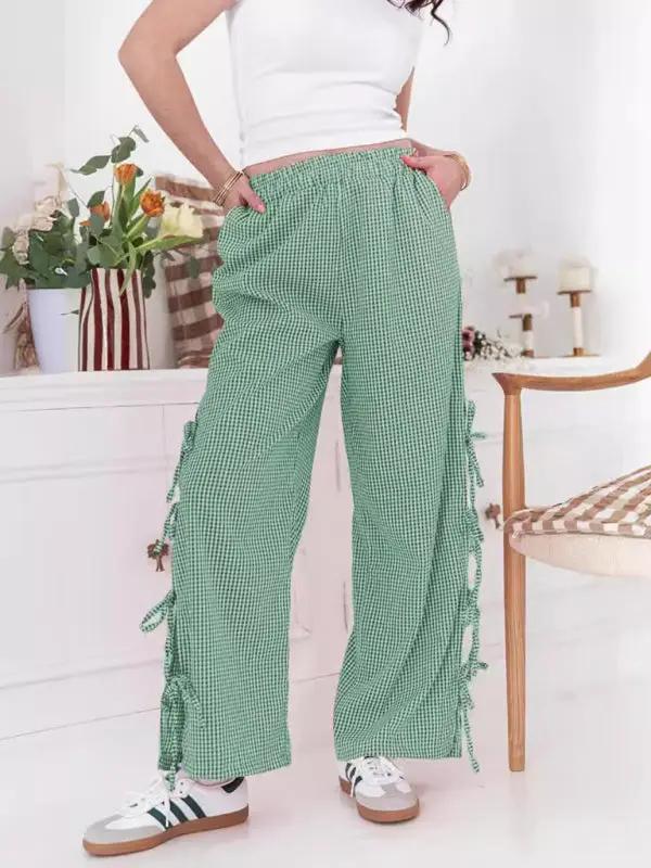 Levoire | Mode dames pantalons carotte avec motif à carreaux et bretelles