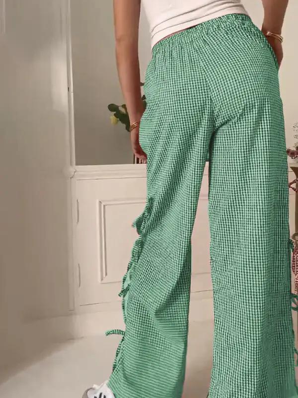 Levoire | Mode dames pantalons carotte avec motif à carreaux et bretelles