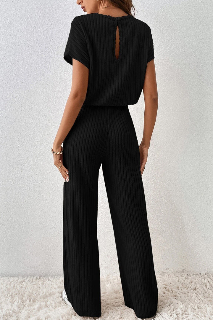 Levoire | Salopette Noire À Côtes Avec Jambes Larges Pour Femmes